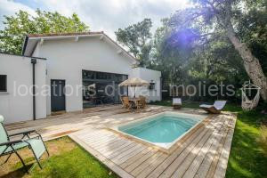 Photo de la Maisons de vacances Superb villa with terrace and pool near the Ocean à Moliets-et-Maa