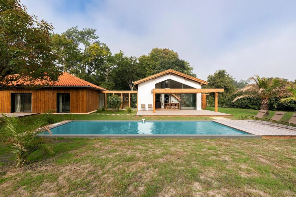 Photo de Villa des Résiniers piscine, proche plage & forêt